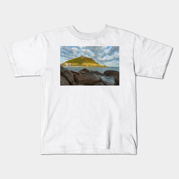 Mount Maunganui stands tall across Main Beach Kids T-Shirt by brians101